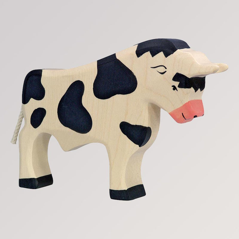 Holztiger Stier schwarz gefleckt