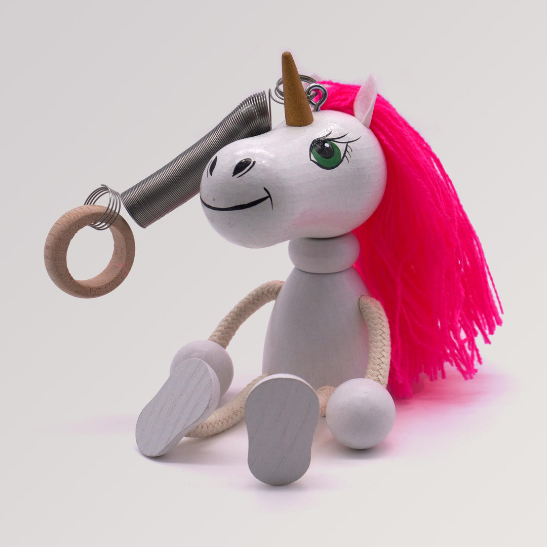 massageöl gleitgel dm Schwingfigur Einhorn aus Holz mit Spiralfeder – Menschenskinder